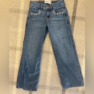 Abercrombie Girls low rise baggy jeans. With flower detail on pockets.